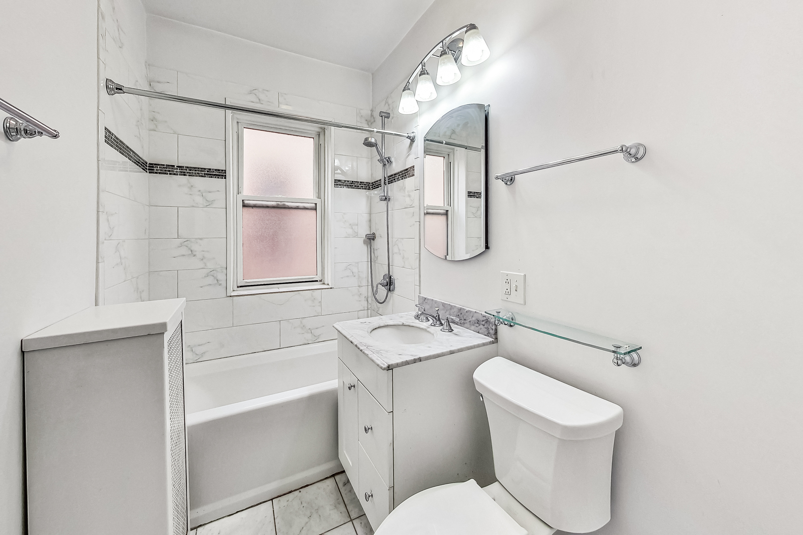 534 Sheridan Road, Unit 3B Evanston, IL 60202 - Photo 29 of 33 a bathroom with a granite countertop sink toilet and shower