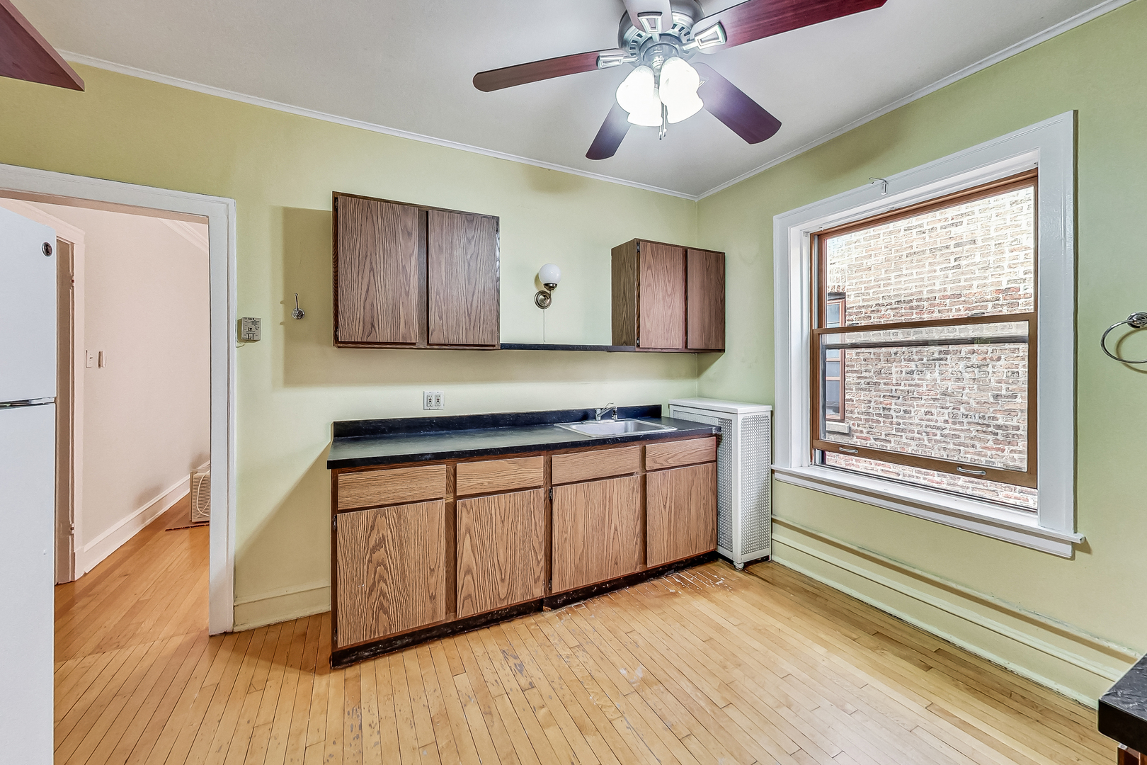 534 Sheridan Road, Unit 3B Evanston, IL 60202 - Photo 31 of 33 a kitchen with stainless steel appliances granite countertop cabinets and wooden floor