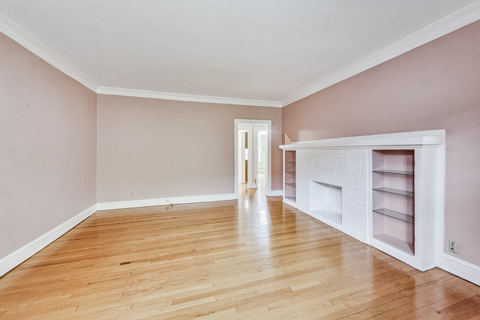 534 Sheridan Road, Unit 3B Evanston, IL 60202 - Photo 6 of 33 a view of empty room with wooden floor and fireplace