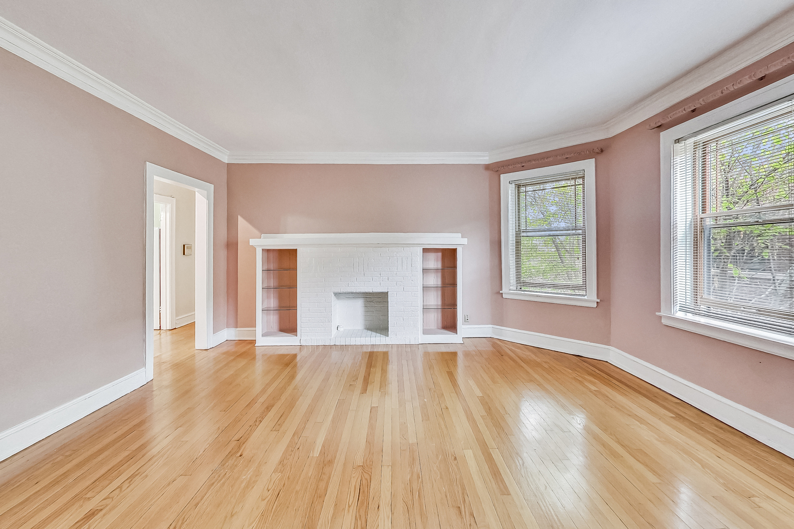 534 Sheridan Road, Unit 3B Evanston, IL 60202 - Photo 10 of 33 wooden floor fireplace and windows in an empty room
