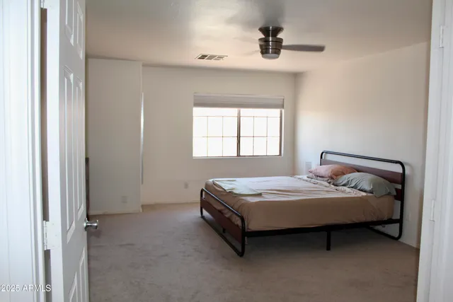 a room with hard wood floors and a window
