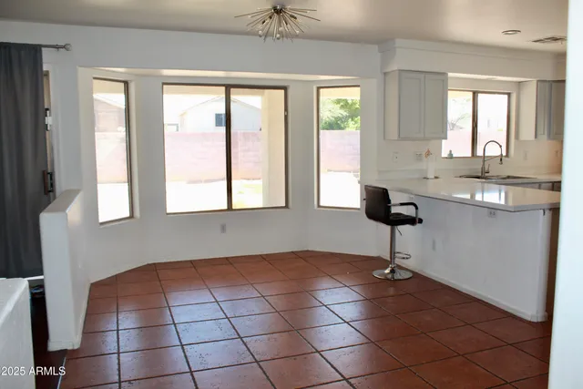 a kitchen with stainless steel appliances a sink stove and refrigerator