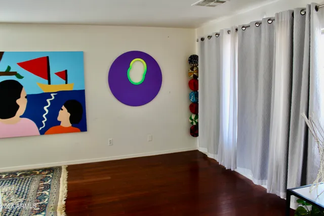 a room with a rug and a wooden floor