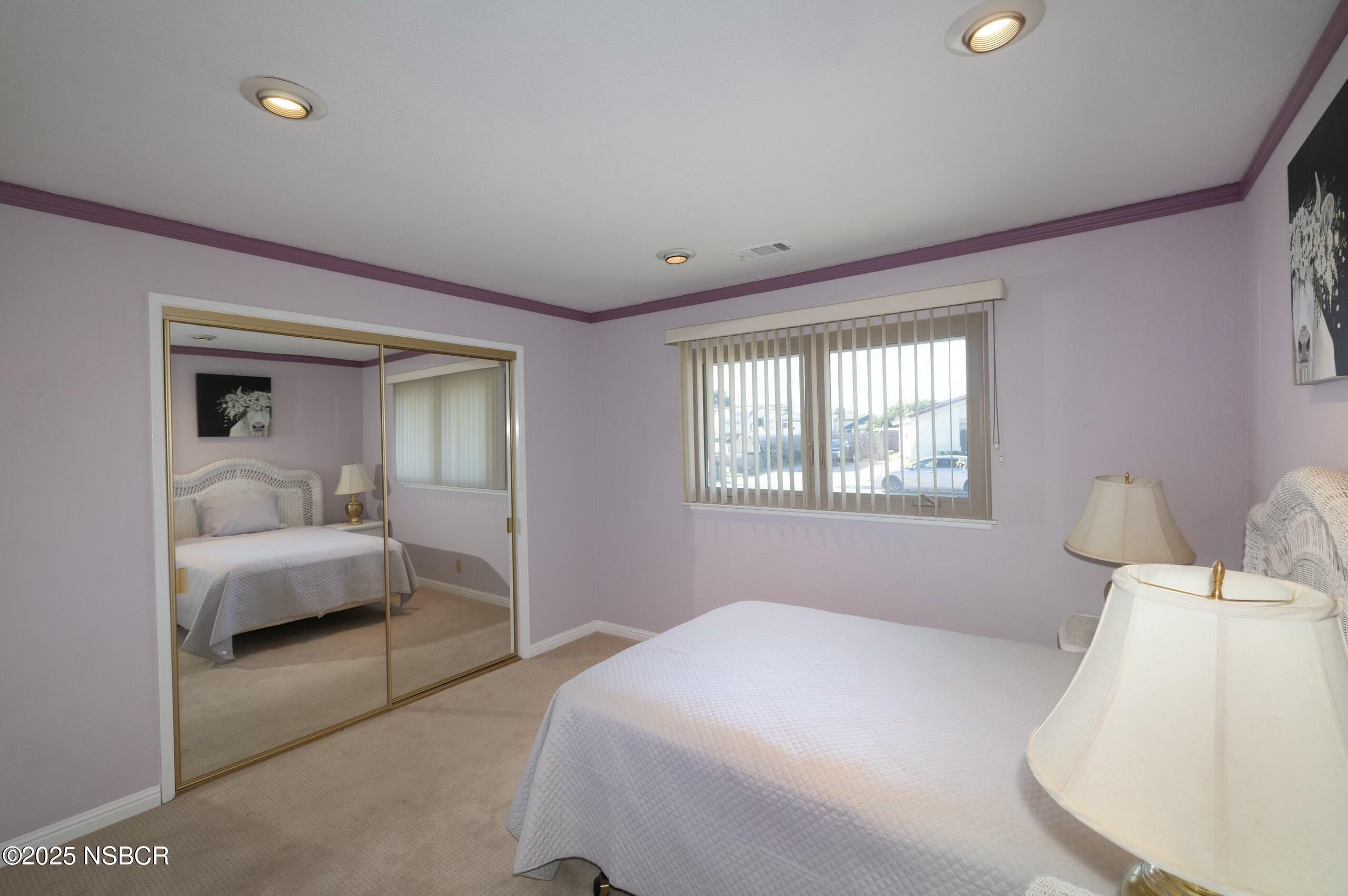 1303 Ruby Court Santa Maria, CA 93454 - Photo 11 of 22 a bedroom with a bed and a couch