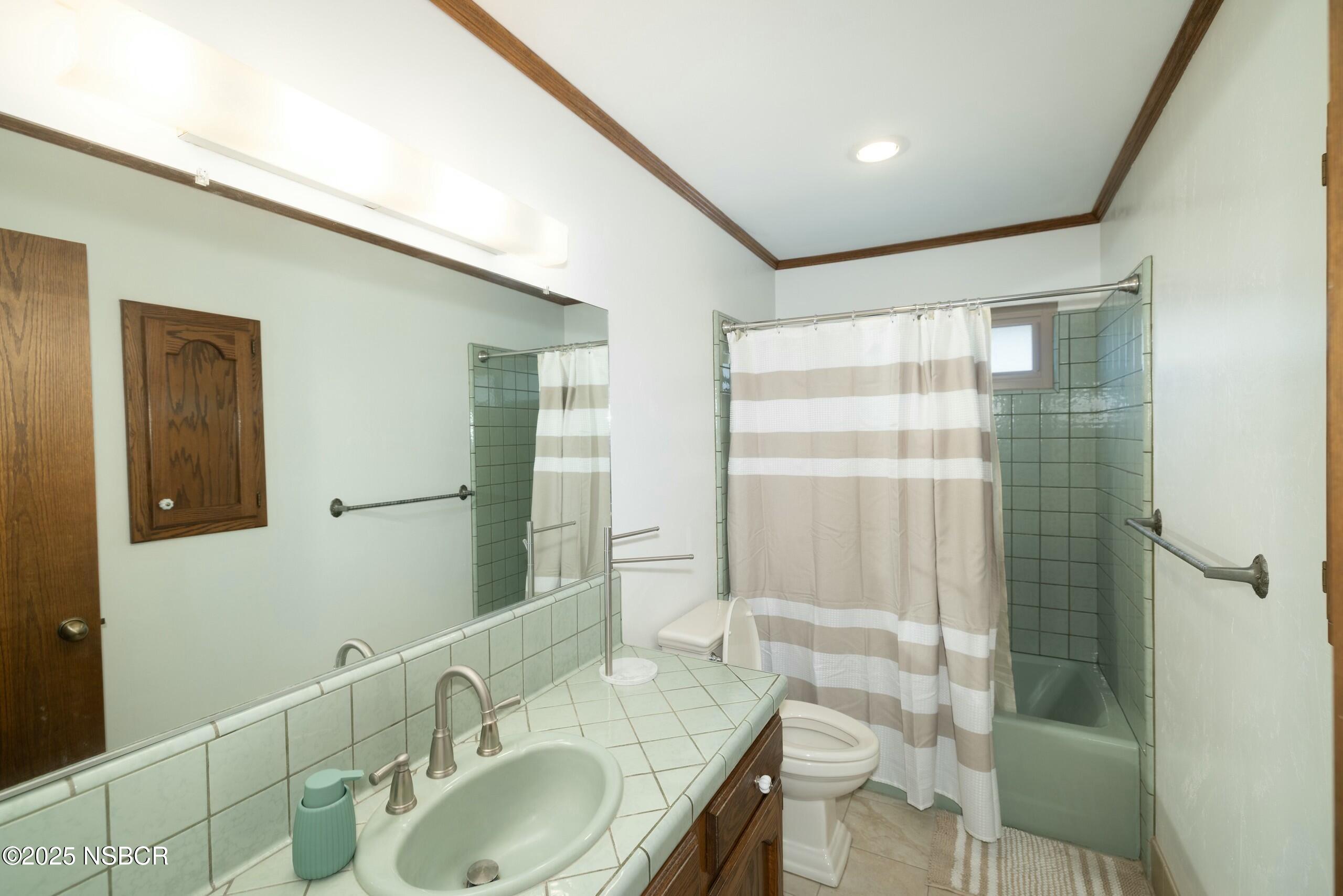 1303 Ruby Court Santa Maria, CA 93454 - Photo 12 of 22 a bathroom with double vanity and a shower