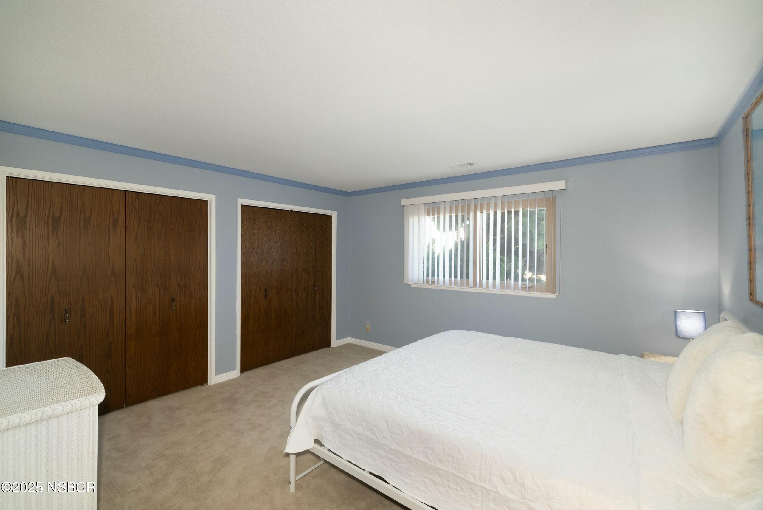 1303 Ruby Court Santa Maria, CA 93454 - Photo 13 of 22 a bedroom with a bed and a window