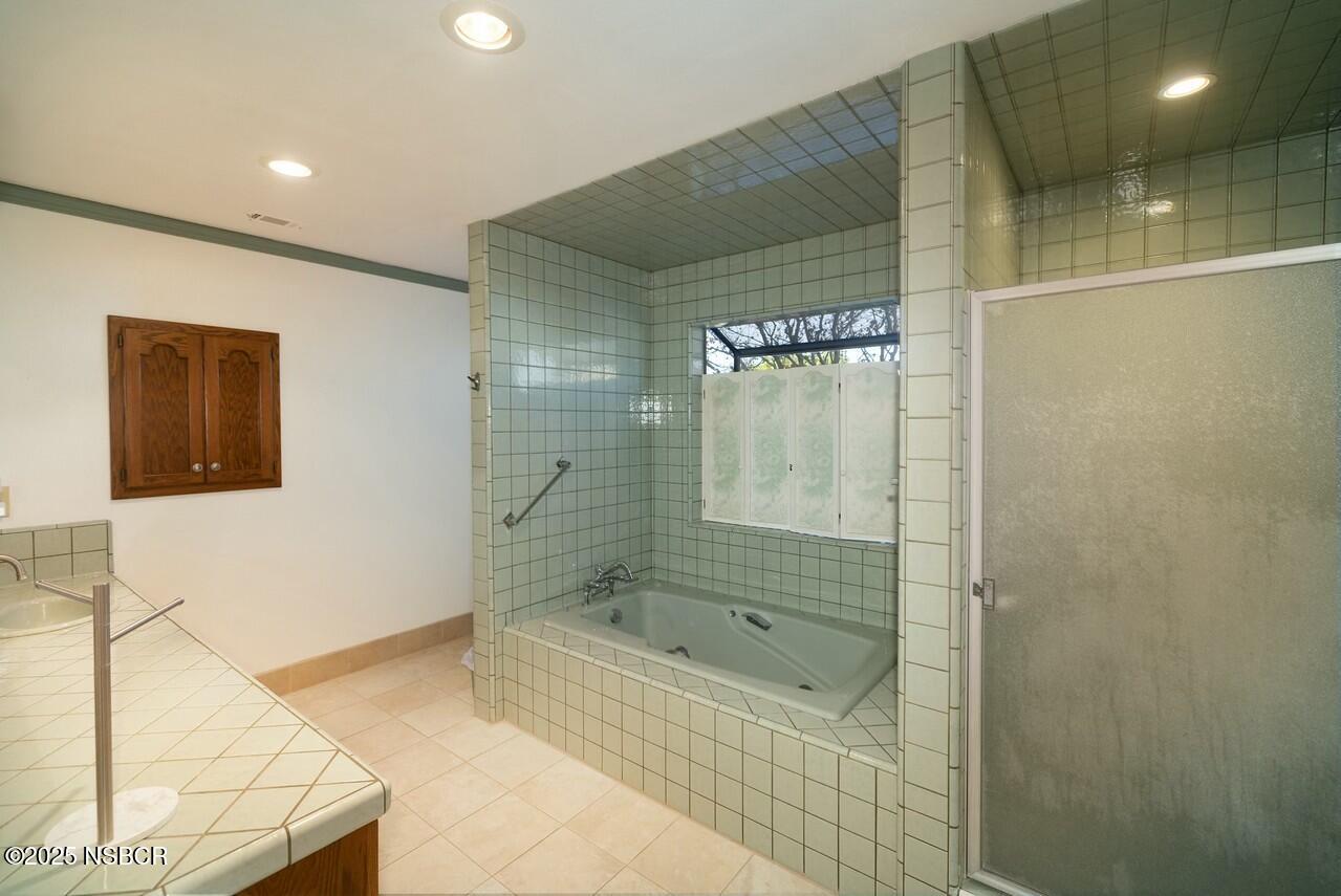 1303 Ruby Court Santa Maria, CA 93454 - Photo 16 of 22 a bathroom with a shower