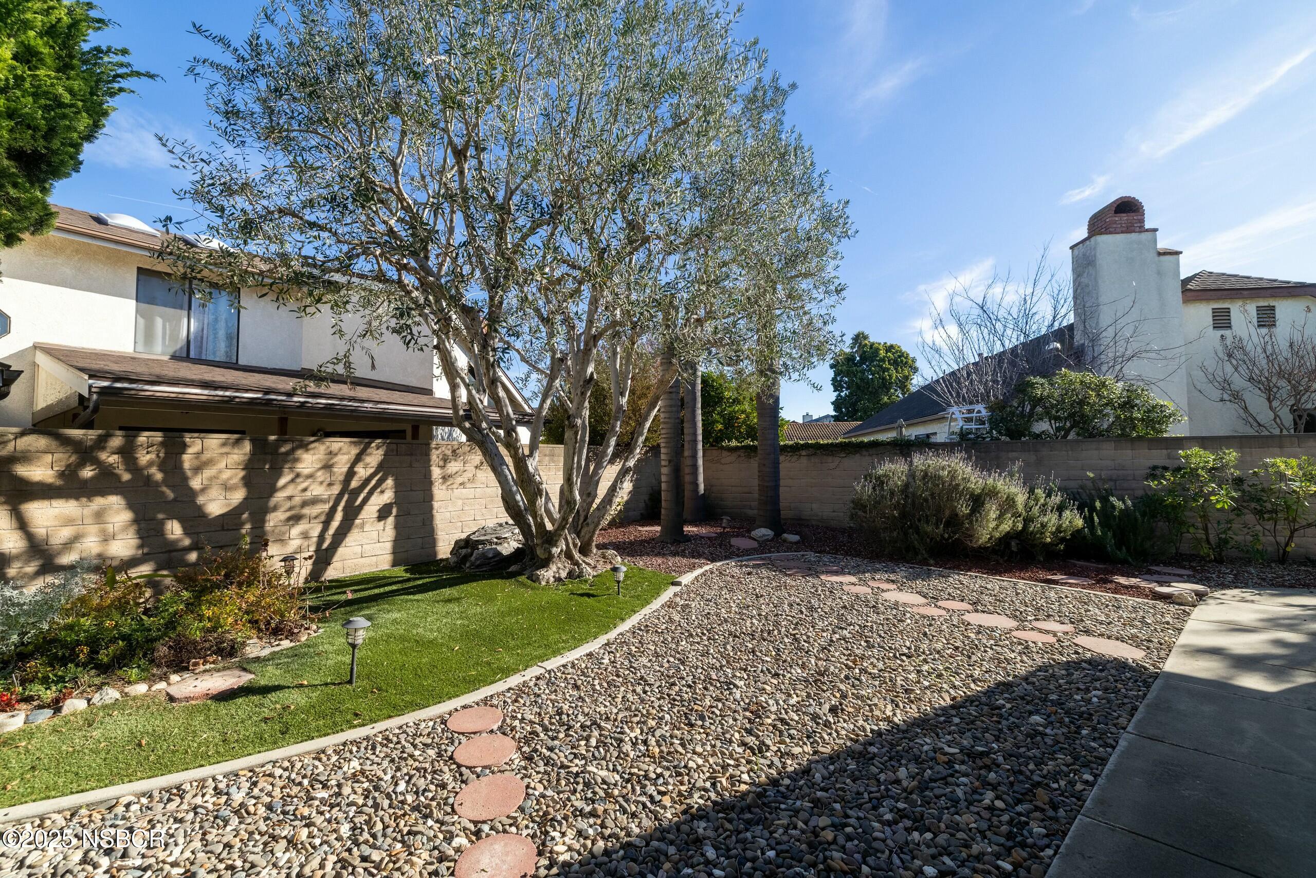 1303 Ruby Court Santa Maria, CA 93454 - Photo 20 of 22 a front view of a house with a yard
