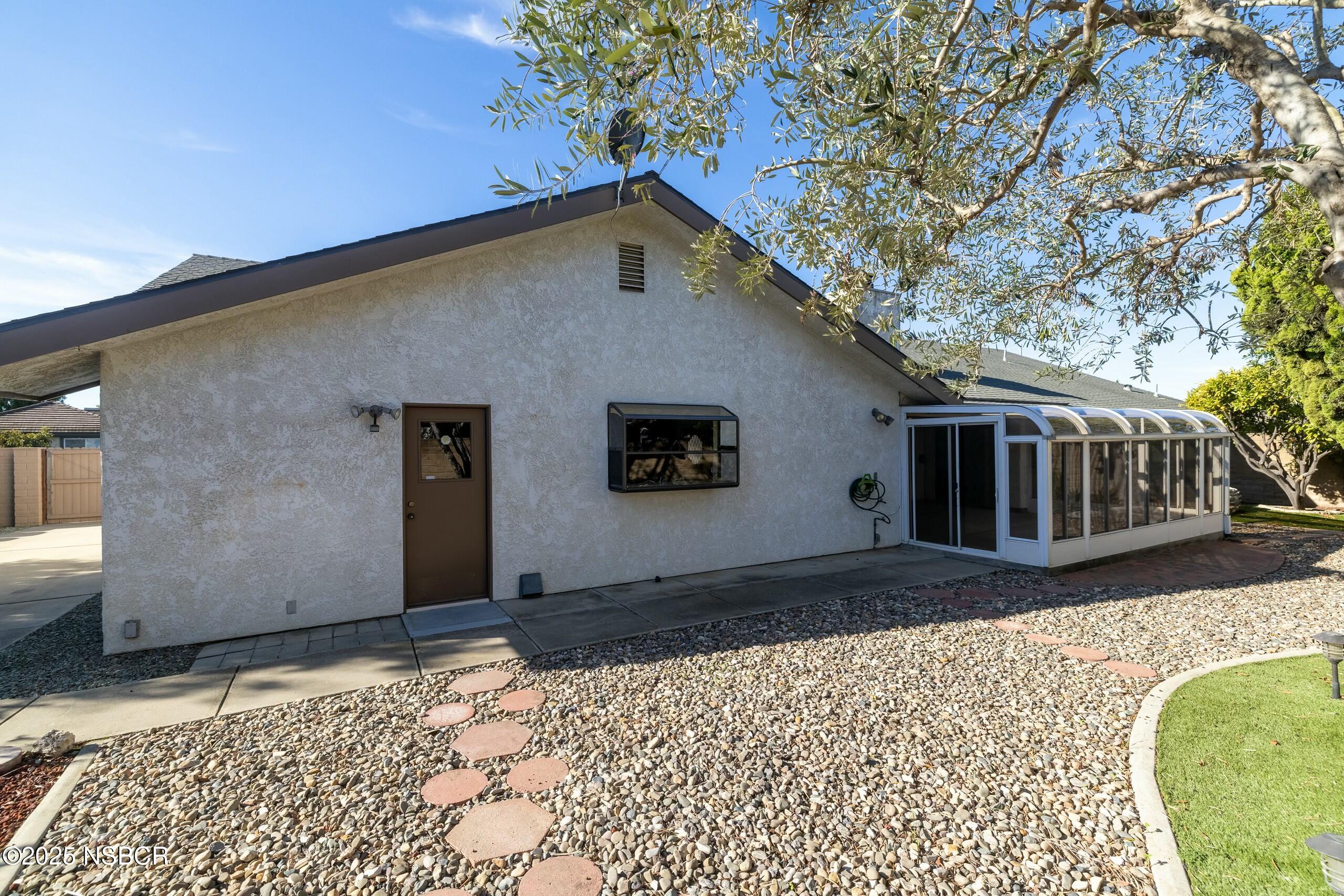 1303 Ruby Court Santa Maria, CA 93454 - Photo 21 of 22 a front view of a house with a yard