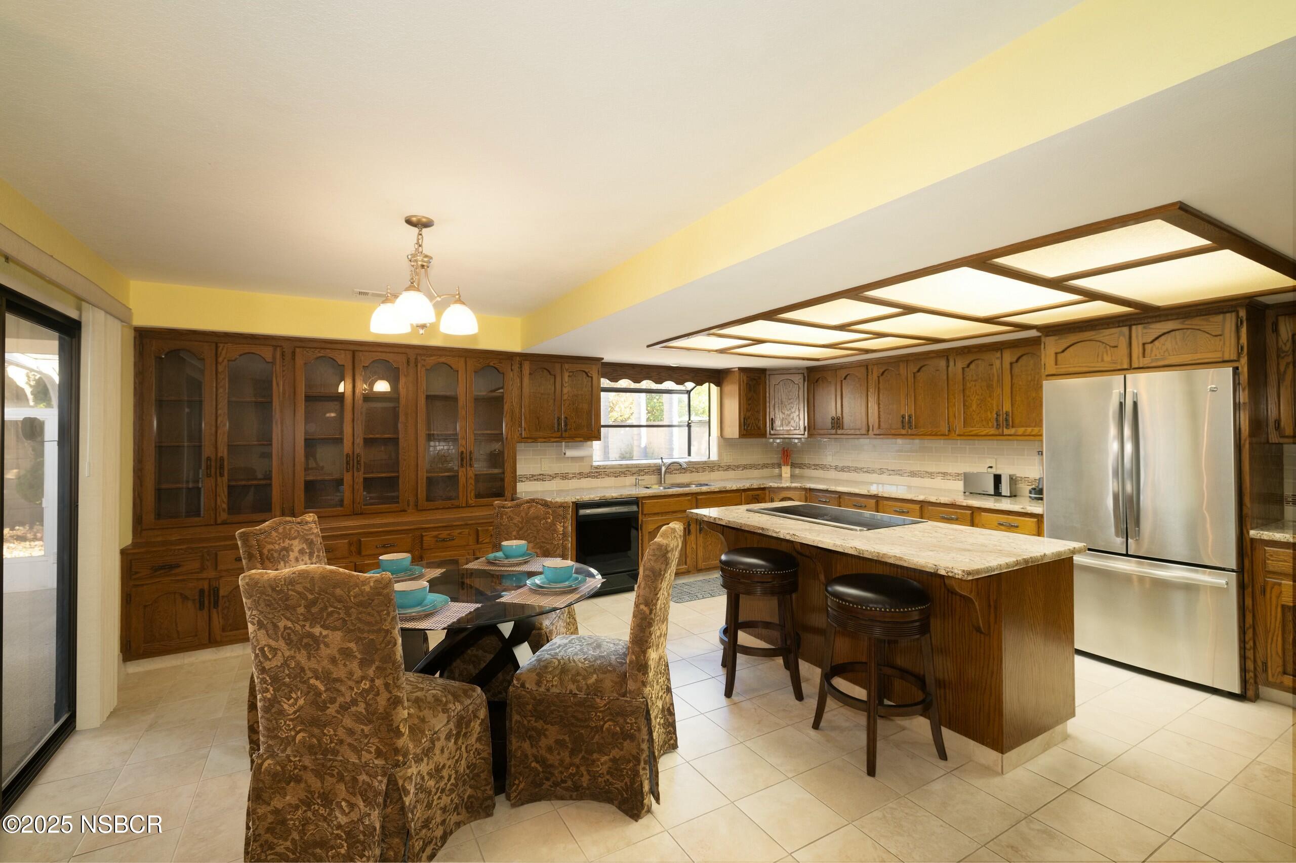 1303 Ruby Court Santa Maria, CA 93454 - Photo 3 of 22 a dinning table and chairs in a room