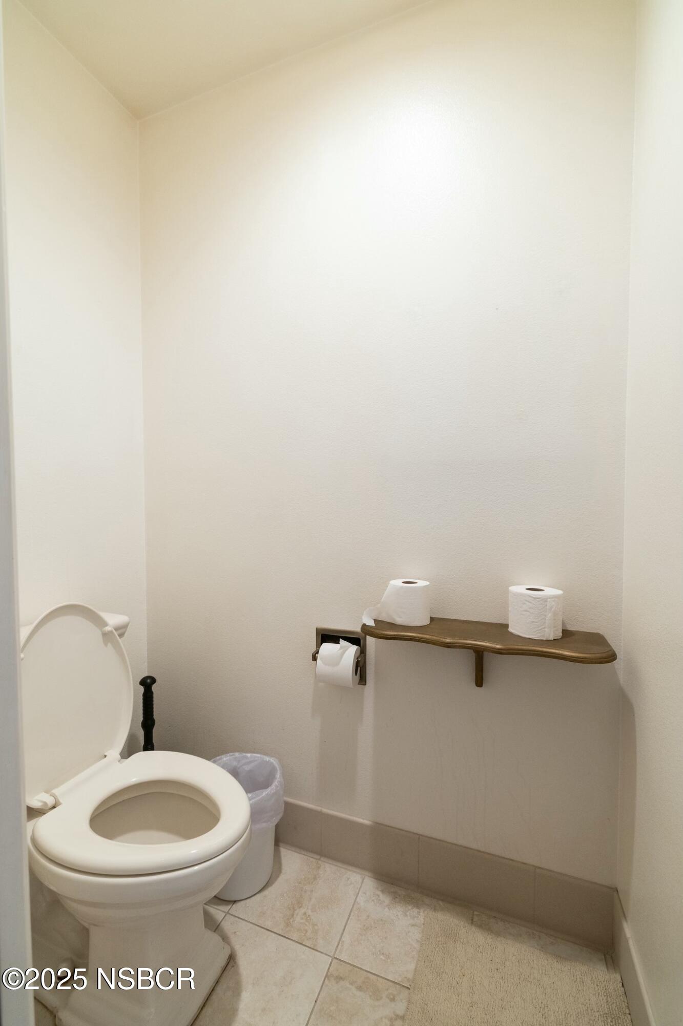 1303 Ruby Court Santa Maria, CA 93454 - Photo 9 of 22 a bathroom with a toilet and a sink