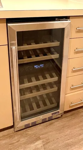 a kitchen with stainless steel appliances a refrigerator and a stove