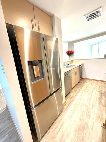 a bathroom with a sink mirror vanity and toilet