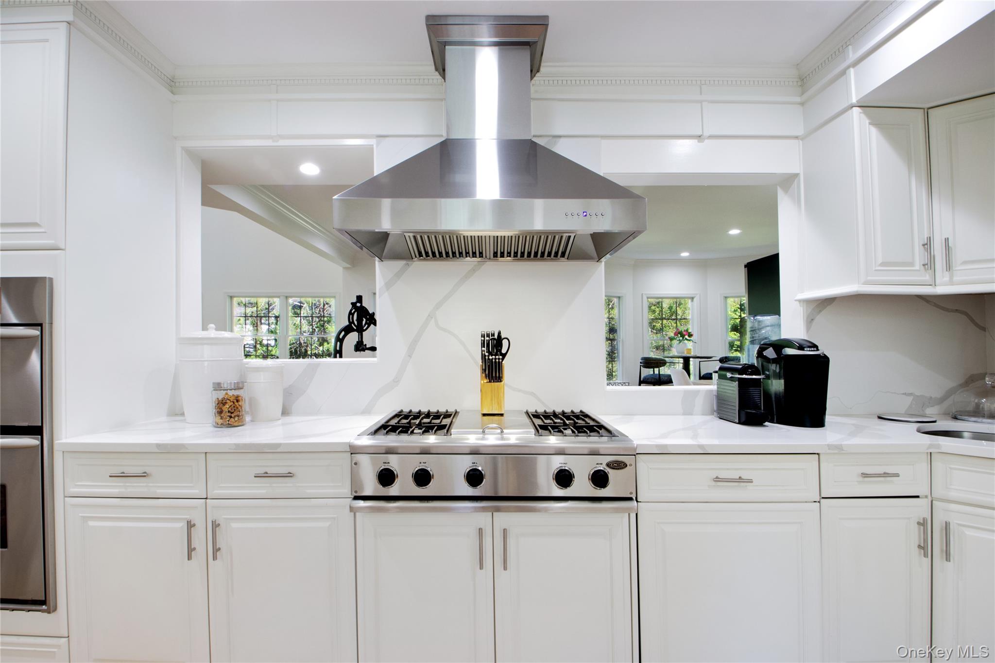 39 Squirrel Hill Road East Hills, NY 11577 - Photo 13 of 35 a kitchen with a stove and cabinets