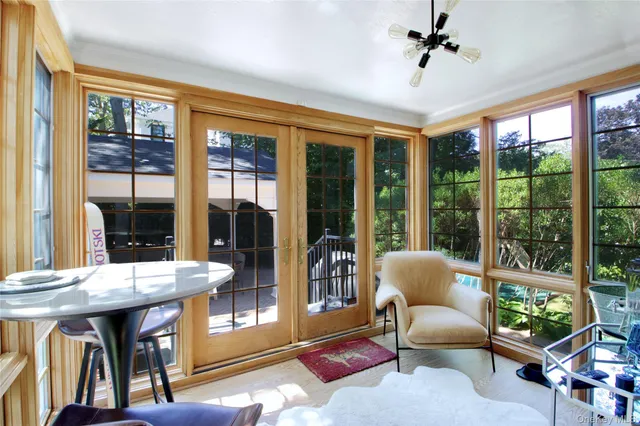 a view of a dining room with furniture window and outside view