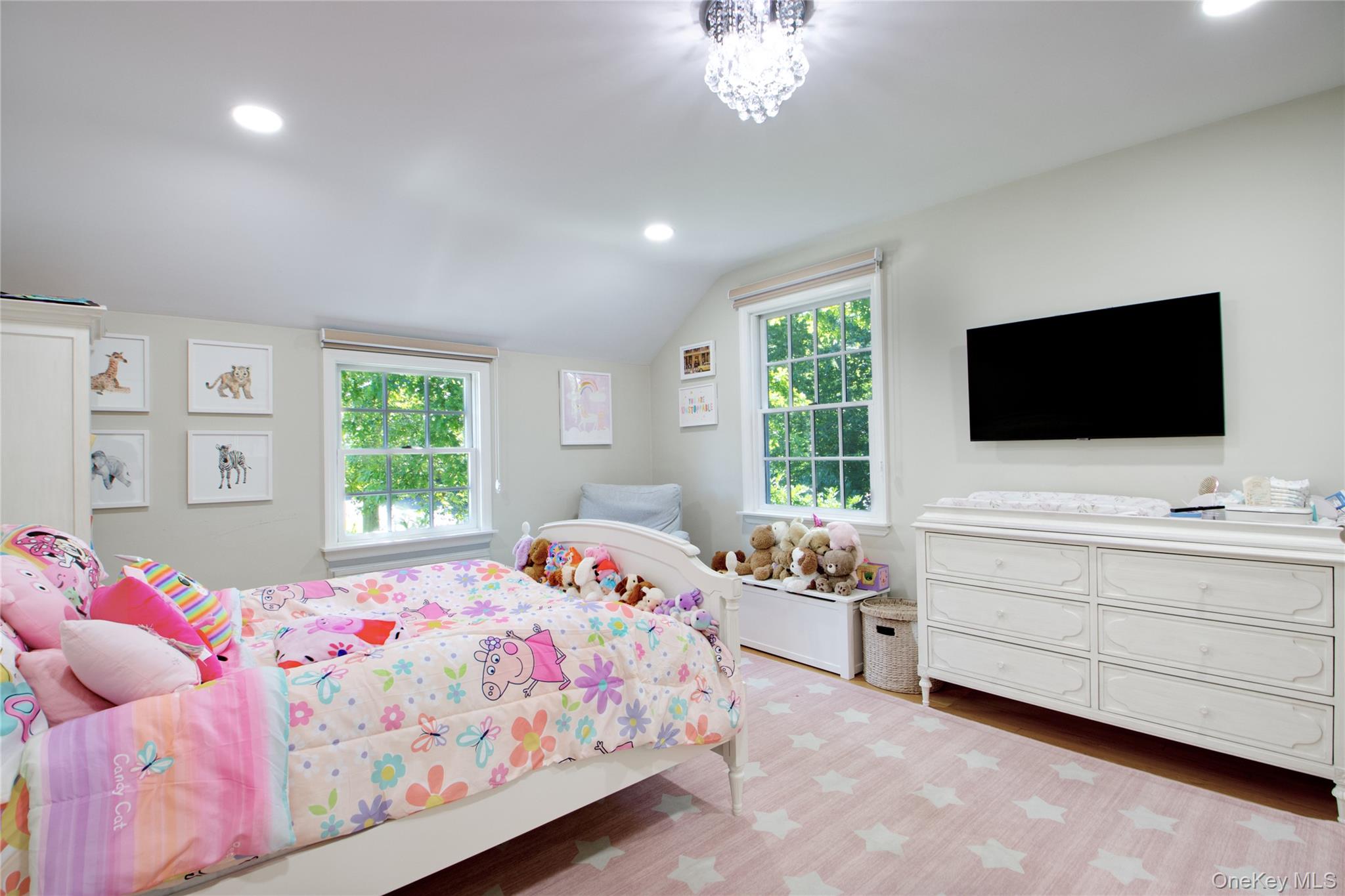 39 Squirrel Hill Road East Hills, NY 11577 - Photo 21 of 35 a bedroom with a bed and a flat screen tv