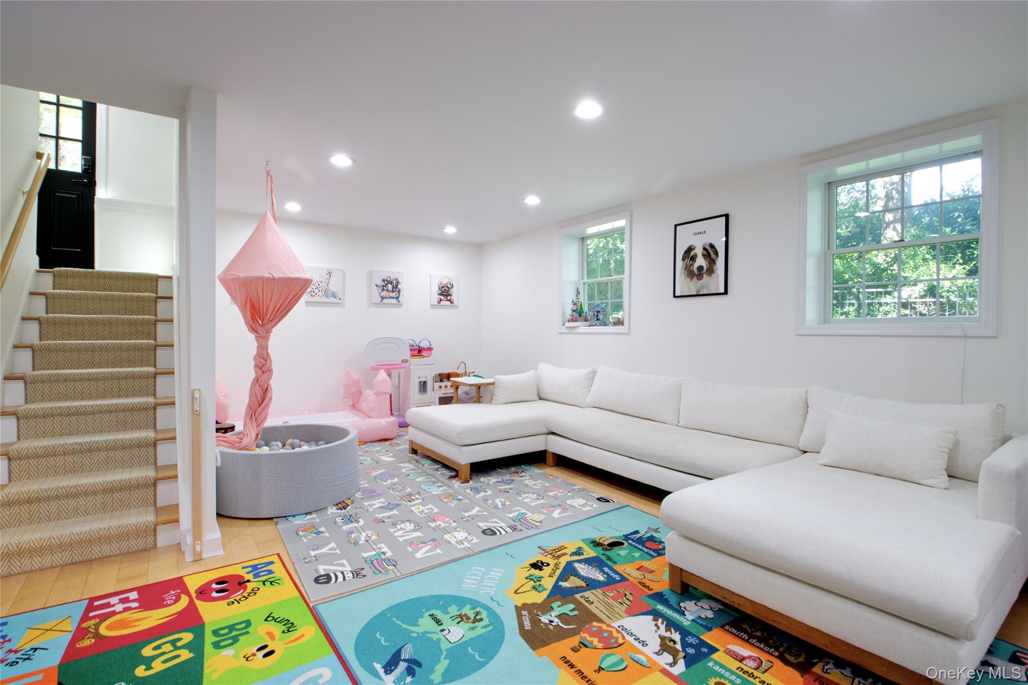 39 Squirrel Hill Road East Hills, NY 11577 - Photo 25 of 35 a living room with furniture and a painting on the wall