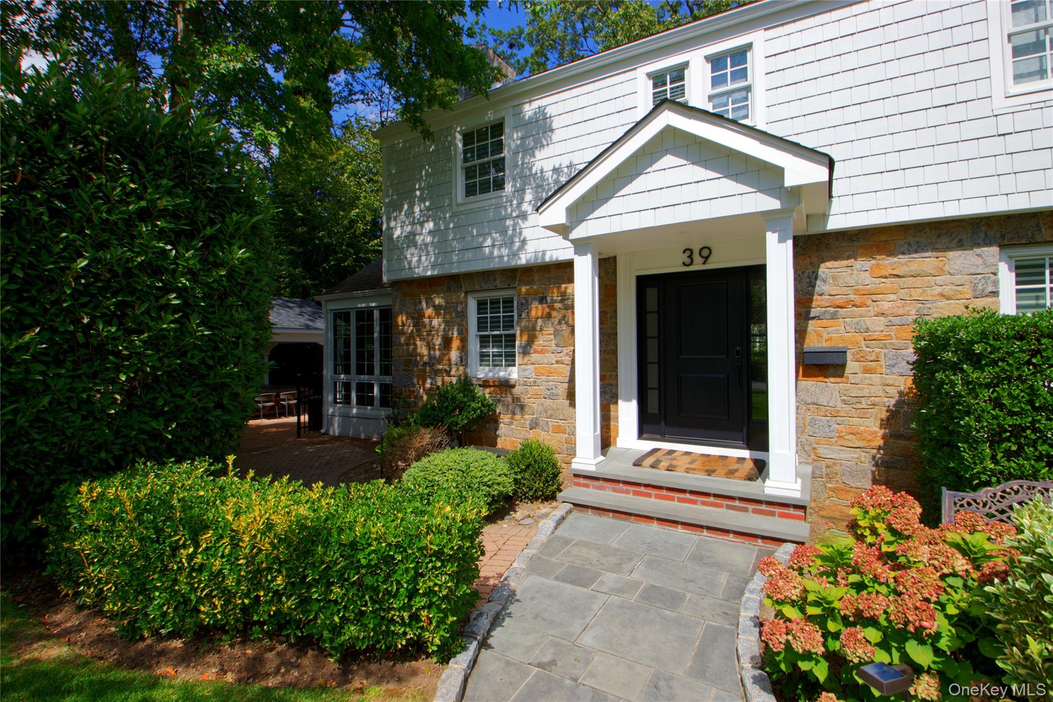 39 Squirrel Hill Road East Hills, NY 11577 - Photo 29 of 35 front view of a house with a yard