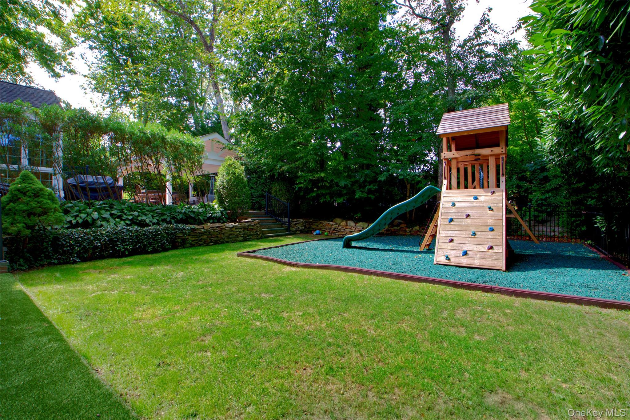39 Squirrel Hill Road East Hills, NY 11577 - Photo 3 of 35 a front view of a house with a yard