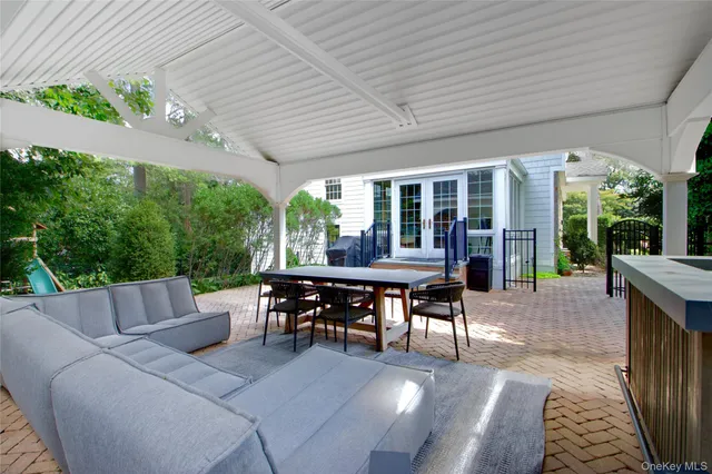a view of a patio with a dining table and chairs