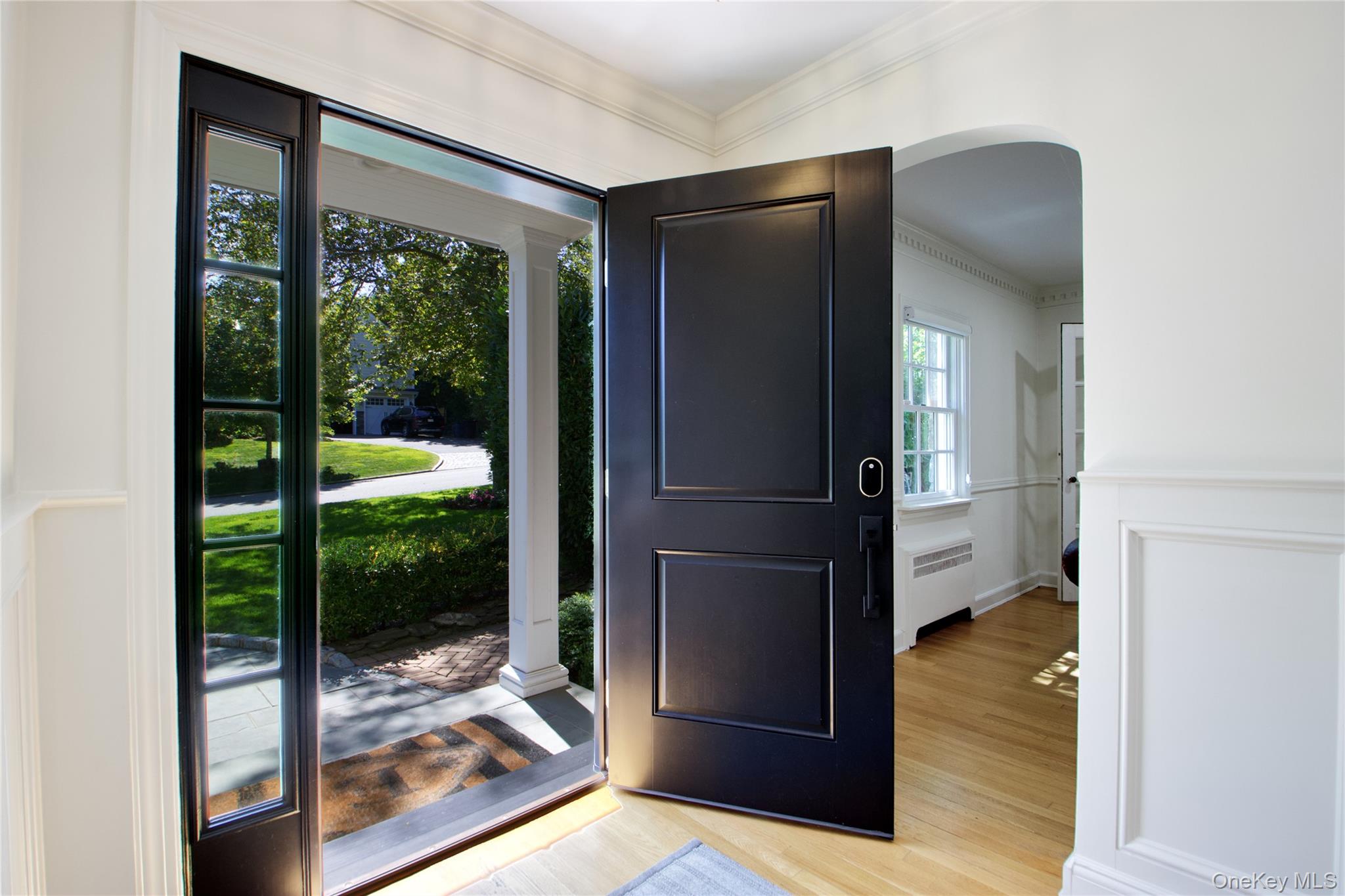 39 Squirrel Hill Road East Hills, NY 11577 - Photo 6 of 35 a view of hallway with living room and floor to ceiling window