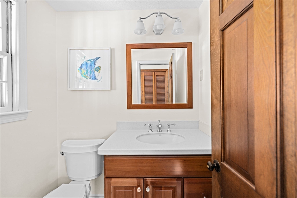 15 Presidents Road Hingham, MA 02043 - Photo 11 of 25 a bathroom with a sink and a mirror