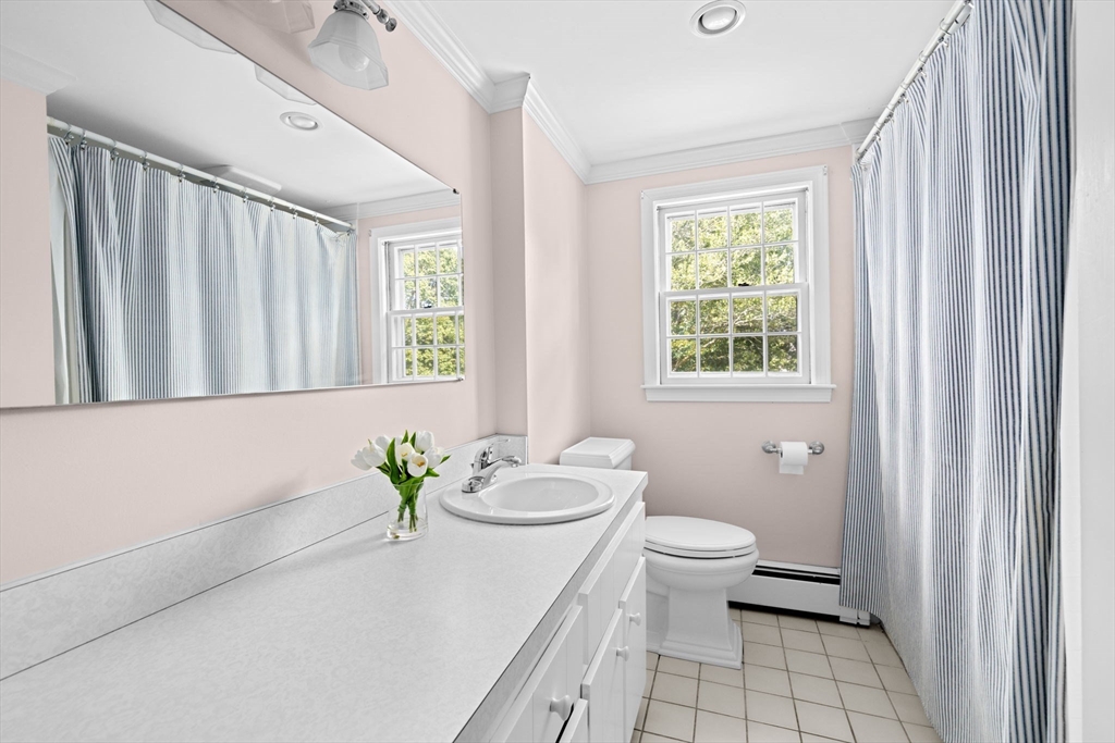 15 Presidents Road Hingham, MA 02043 - Photo 18 of 25 a bath room with a toilet a sink and a mirror