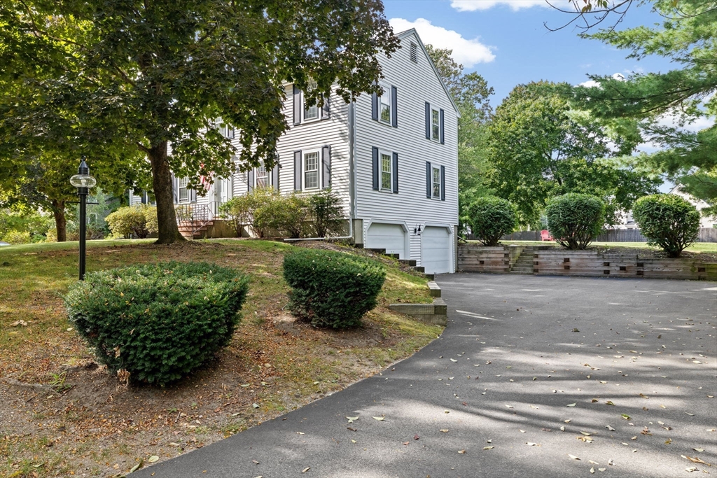 15 Presidents Road Hingham, MA 02043 - Photo 22 of 25 a view of a white house with a yard and plants