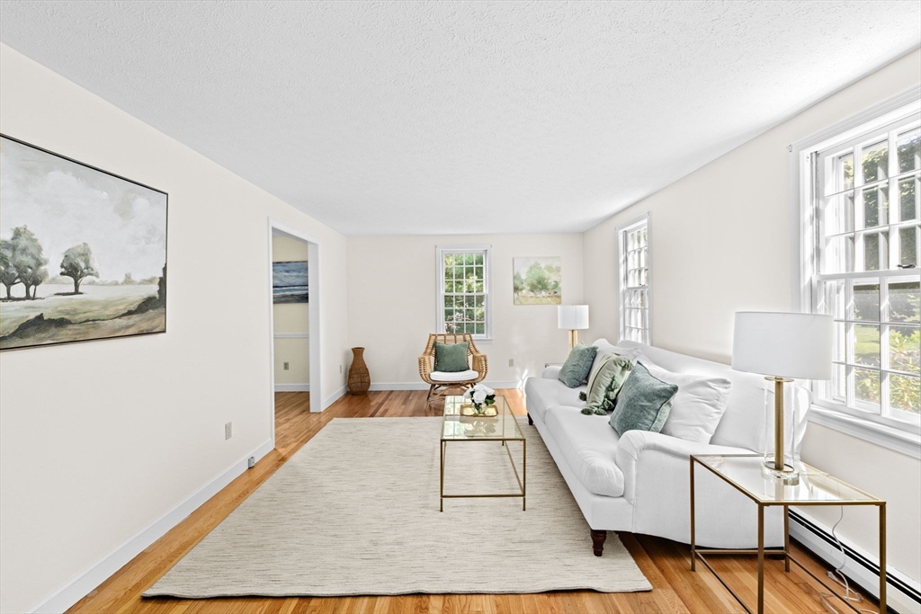 15 Presidents Road Hingham, MA 02043 - Photo 3 of 25 a living room with furniture wooden floor and a large window