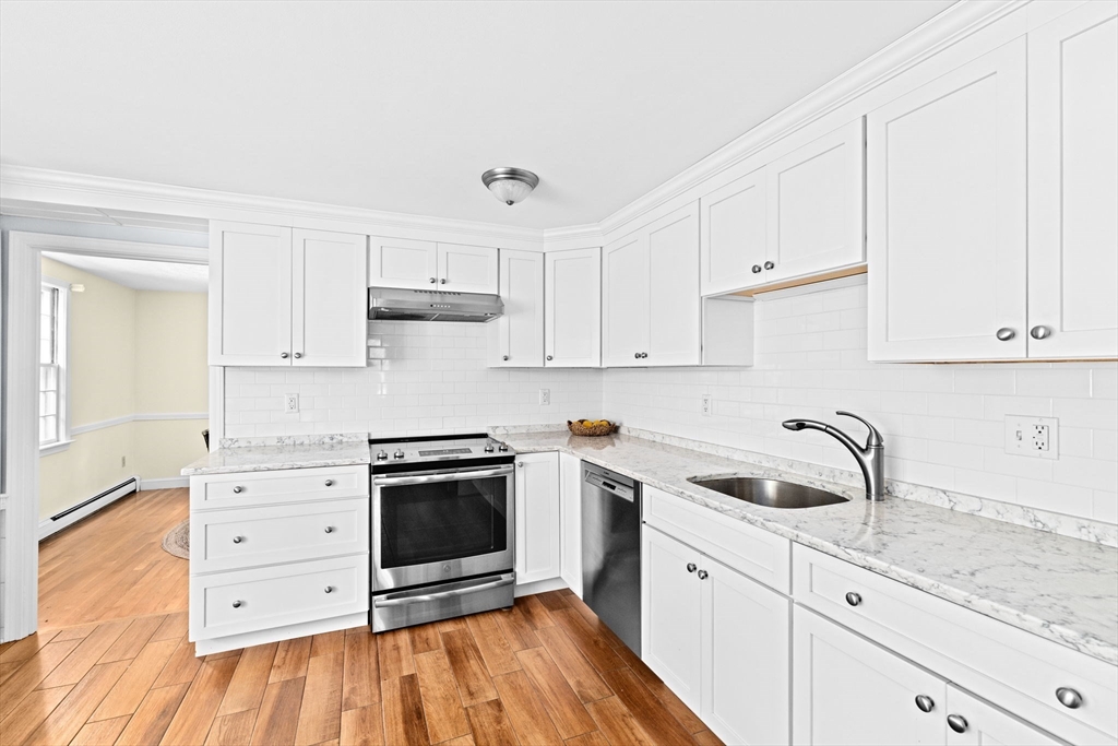 15 Presidents Road Hingham, MA 02043 - Photo 6 of 25 a kitchen with white cabinets appliances and sink