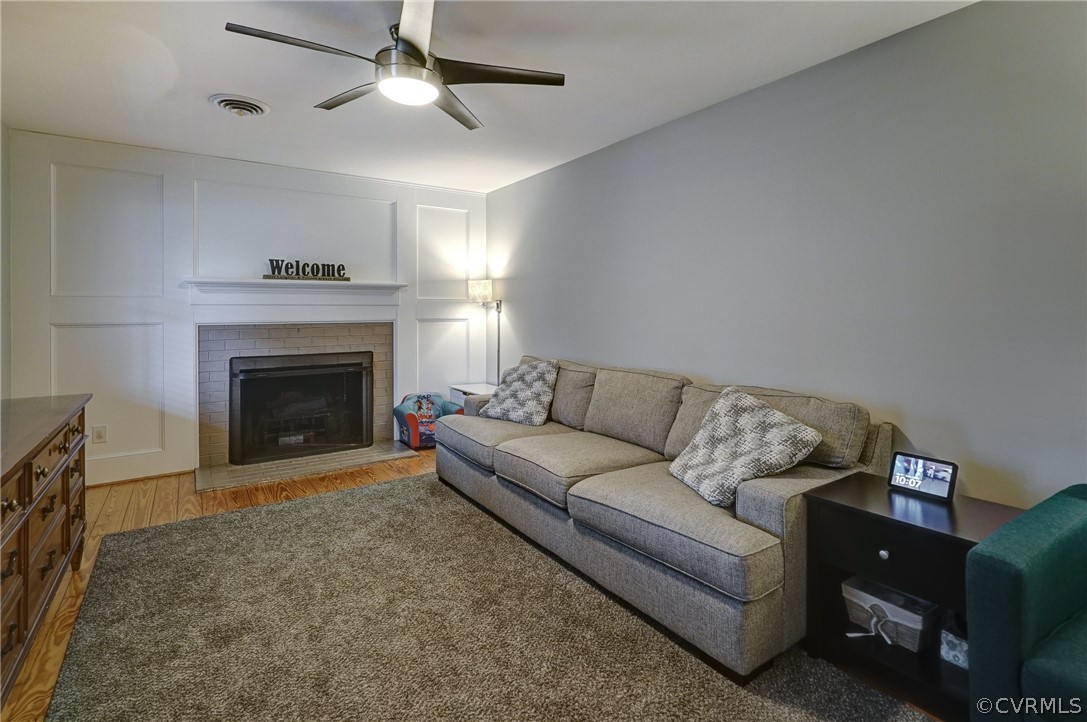 7206 Barkbridge Road Chesterfield, VA 23832 - Photo 13 of 36 a living room with furniture and a fireplace