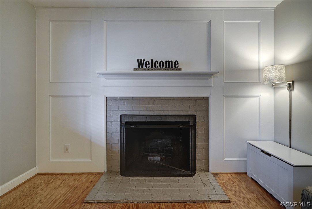 7206 Barkbridge Road Chesterfield, VA 23832 - Photo 15 of 36 a living room with a fireplace and a rug