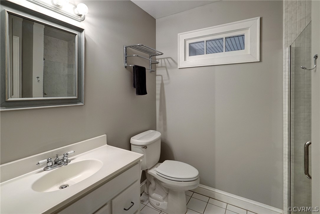 7206 Barkbridge Road Chesterfield, VA 23832 - Photo 17 of 36 a bathroom with a sink mirror toilet and vanity