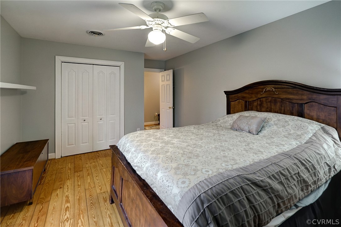 7206 Barkbridge Road Chesterfield, VA 23832 - Photo 20 of 36 a bedroom with a bed and a chandelier