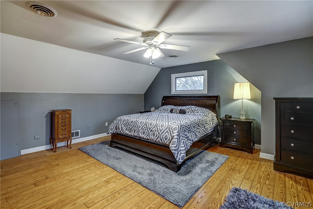 7206 Barkbridge Road Chesterfield, VA 23832 - Photo 24 of 36 a bedroom with a bed and a dresser with mirror