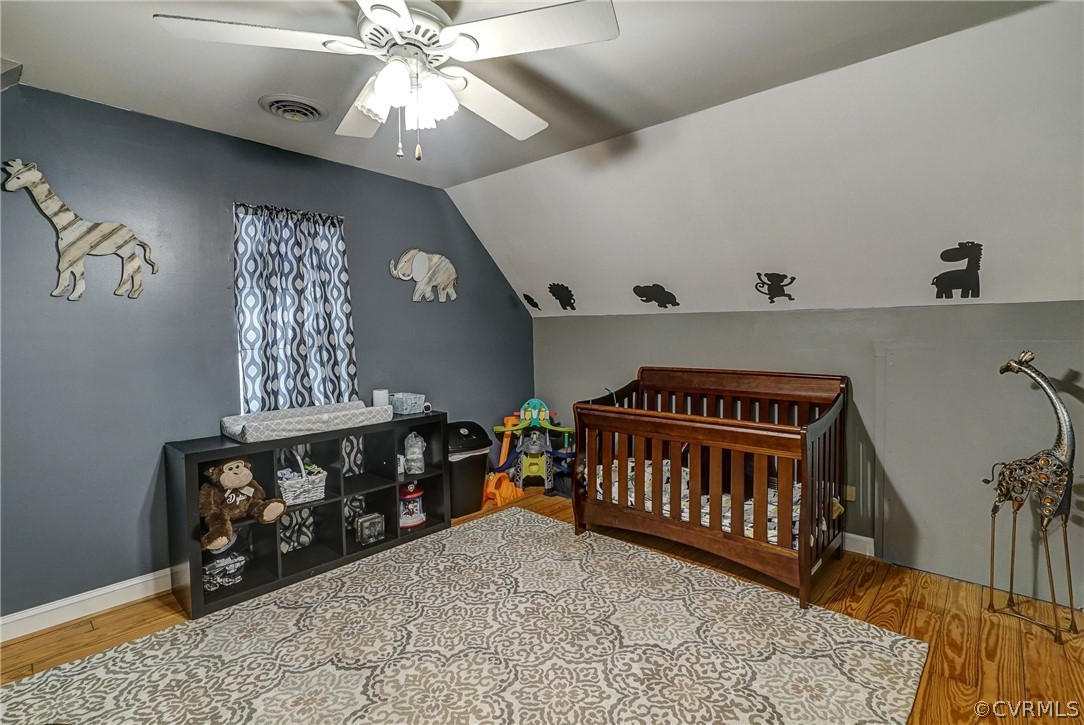 7206 Barkbridge Road Chesterfield, VA 23832 - Photo 26 of 36 a bedroom with furniture and a chandelier