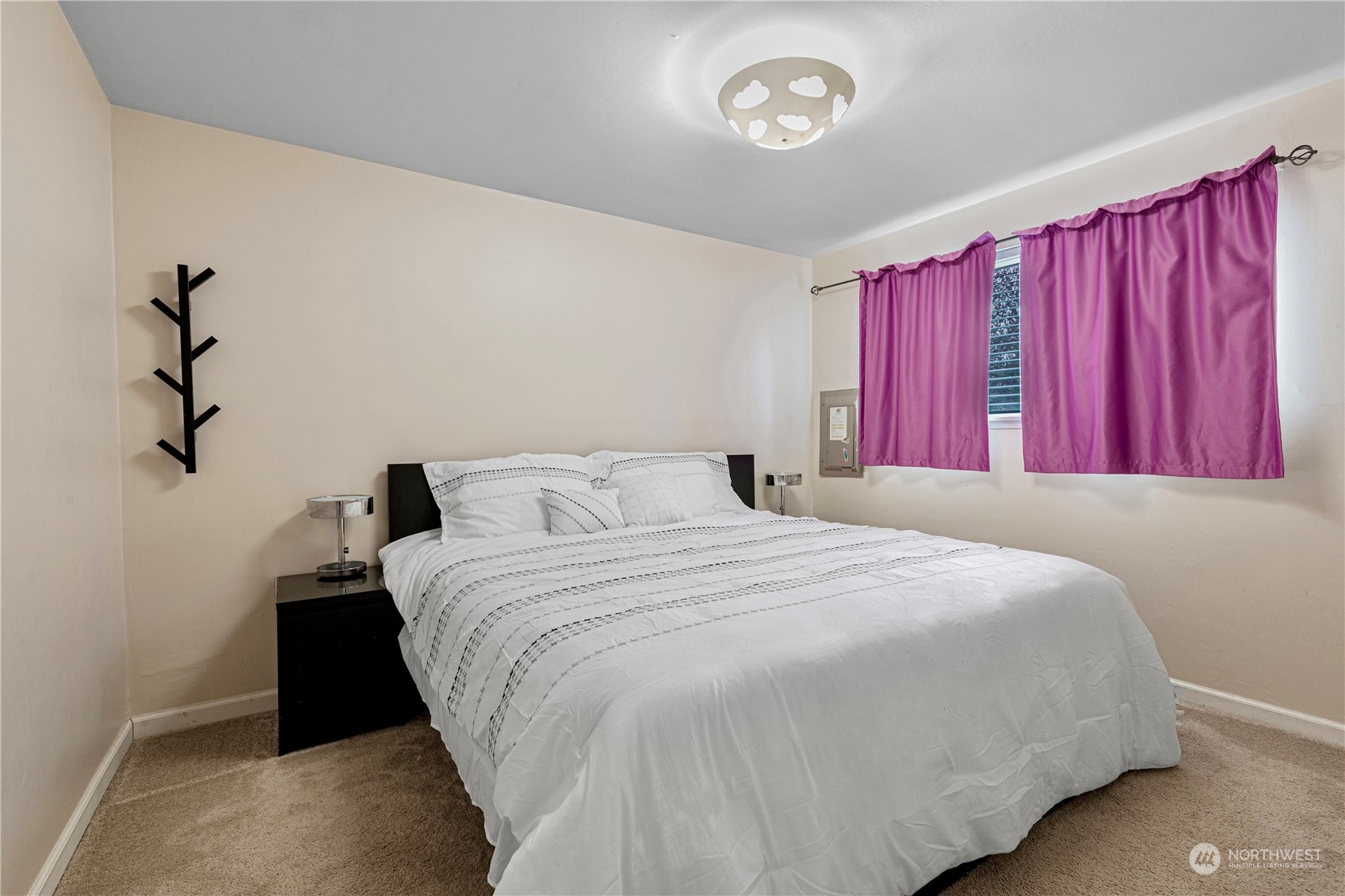 3724 Northeast 9th Street Renton, WA 98056 - Photo 11 of 16 a bedroom with a bed and a window