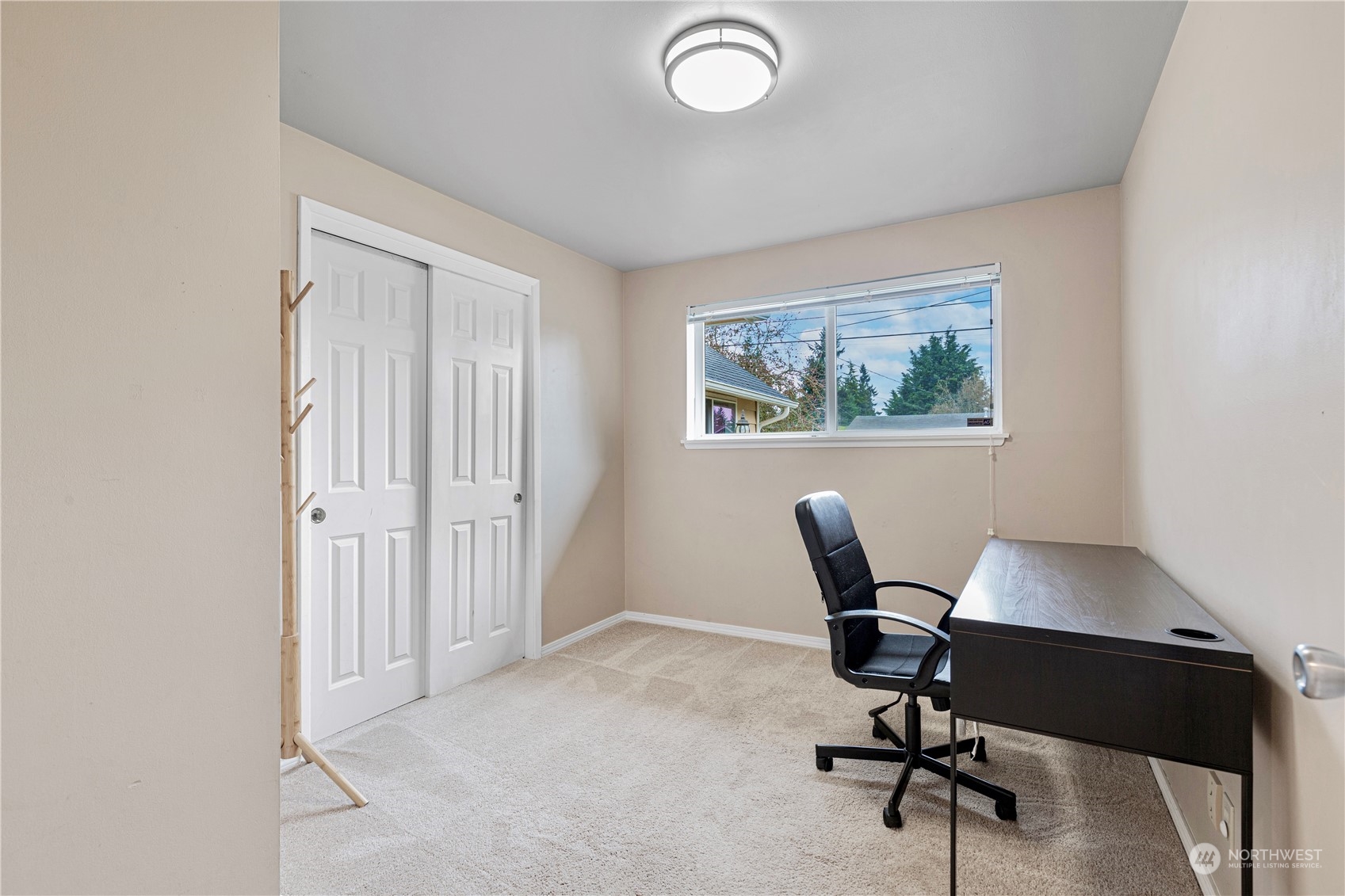 3724 Northeast 9th Street Renton, WA 98056 - Photo 13 of 16 a view of a workspace with furniture and a window
