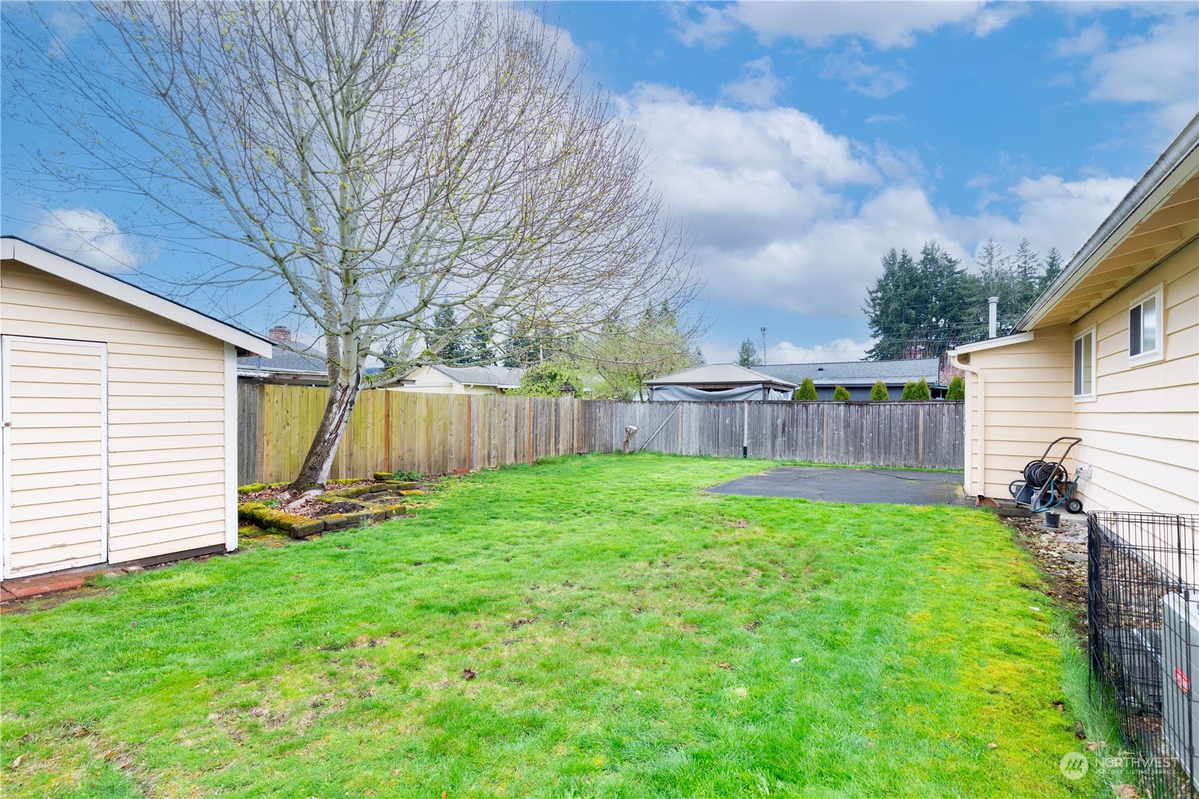 3724 Northeast 9th Street Renton, WA 98056 - Photo 14 of 16 a view of a backyard with a garden