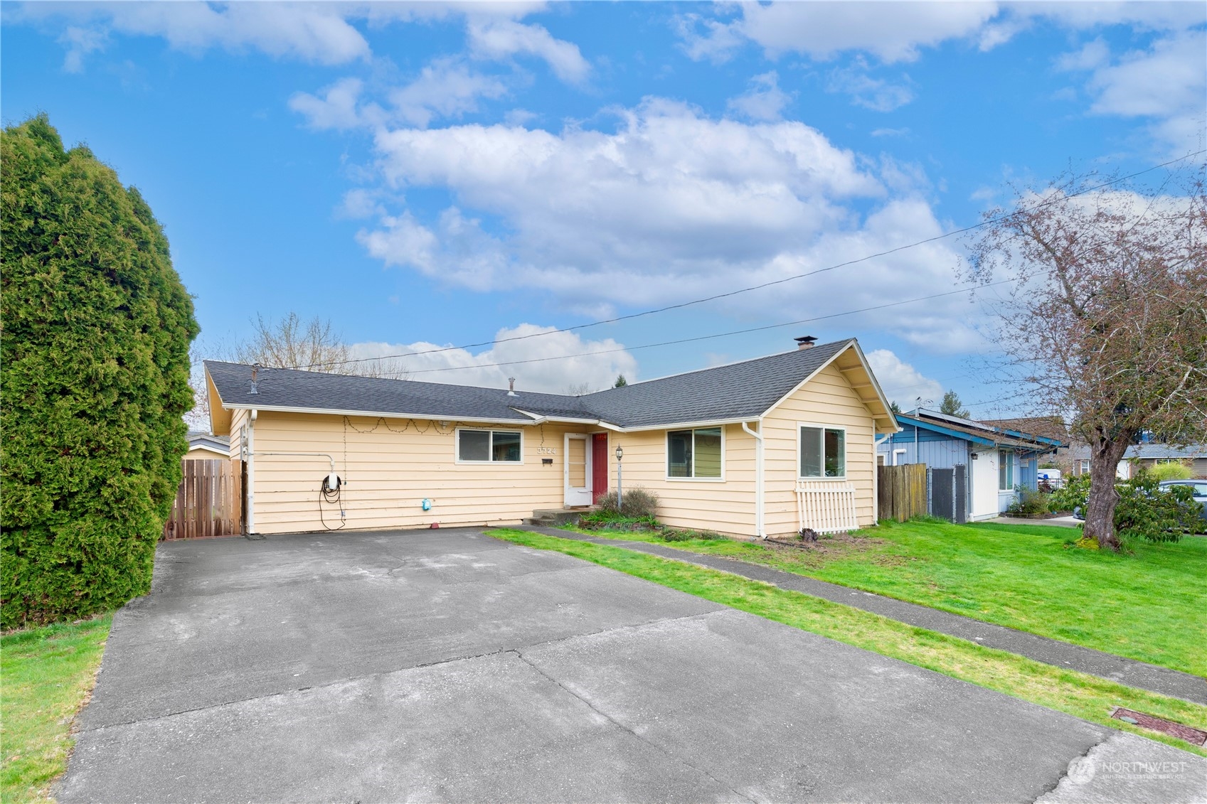 3724 Northeast 9th Street Renton, WA 98056 - Photo 2 of 16 a front view of a house with a yard and garage
