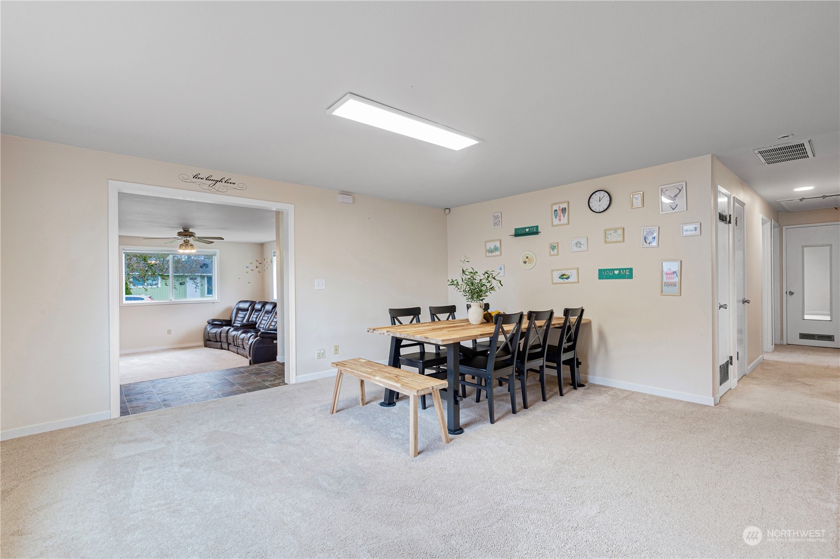 3724 Northeast 9th Street Renton, WA 98056 - Photo 6 of 16 a dining room with furniture and a chandelier