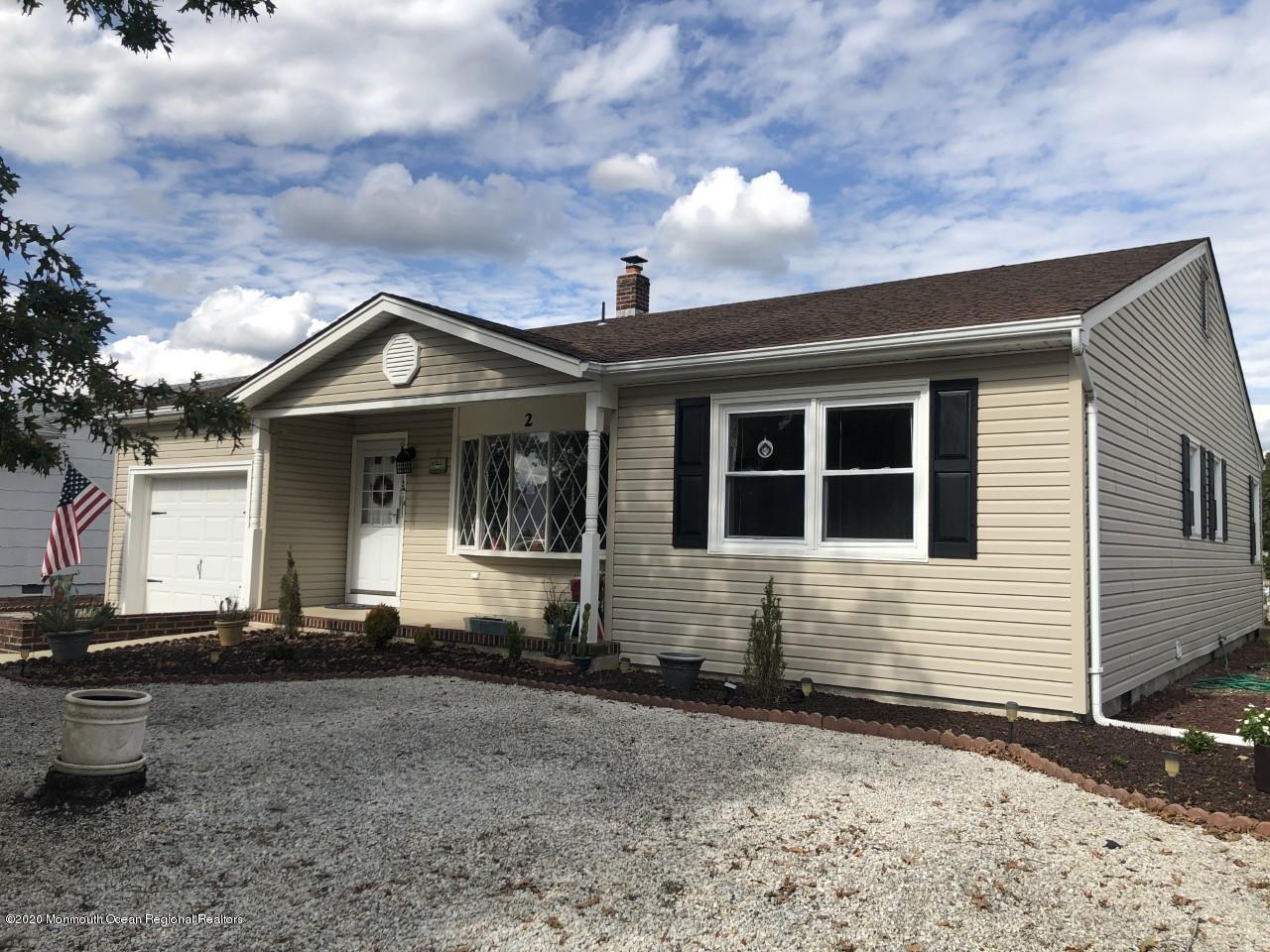 a front view of a house with yard