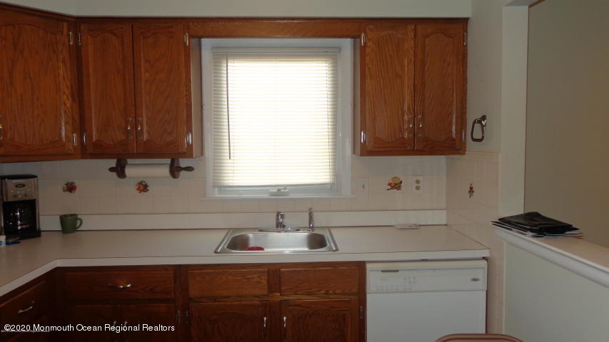 2 Sheridan Road Toms River, NJ 08757 - Photo 5 of 14 a kitchen with a sink cabinets and window
