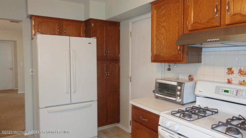2 Sheridan Road Toms River, NJ 08757 - Photo 6 of 14 a kitchen with a stove and a refrigerator