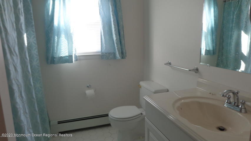 2 Sheridan Road Toms River, NJ 08757 - Photo 9 of 14 a bathroom with a sink toilet and window