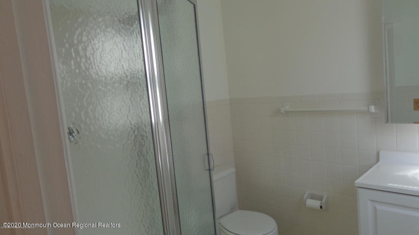 2 Sheridan Road Toms River, NJ 08757 - Photo 10 of 14 a bathroom with a granite countertop toilet and a sink