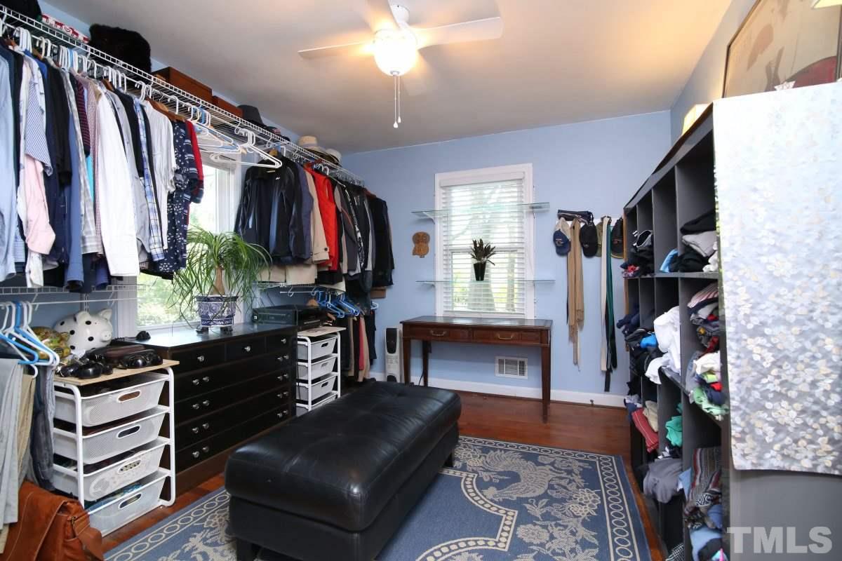 1106 Southerlund Road Garner, NC 27529 - Photo 13 of 24 a view of walk in closet with clothes and shoes