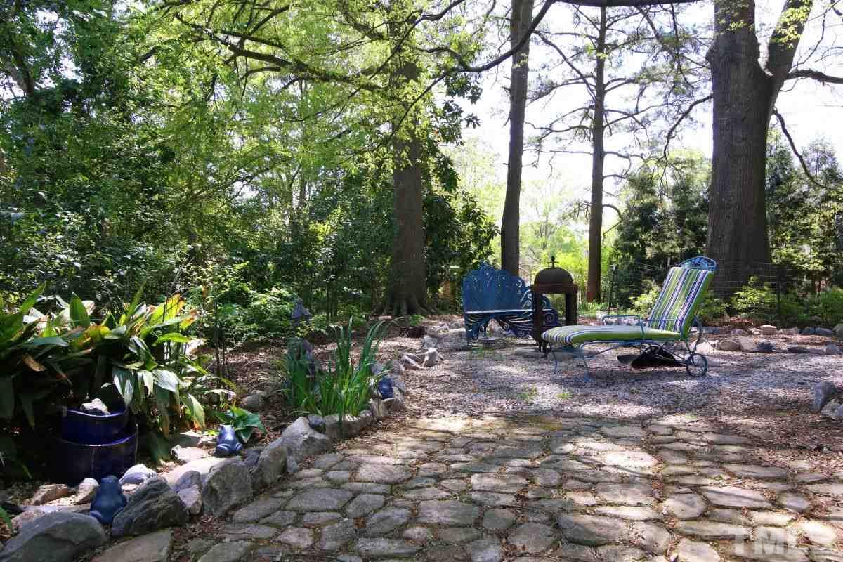 1106 Southerlund Road Garner, NC 27529 - Photo 24 of 24 a view of a fire pit with large trees