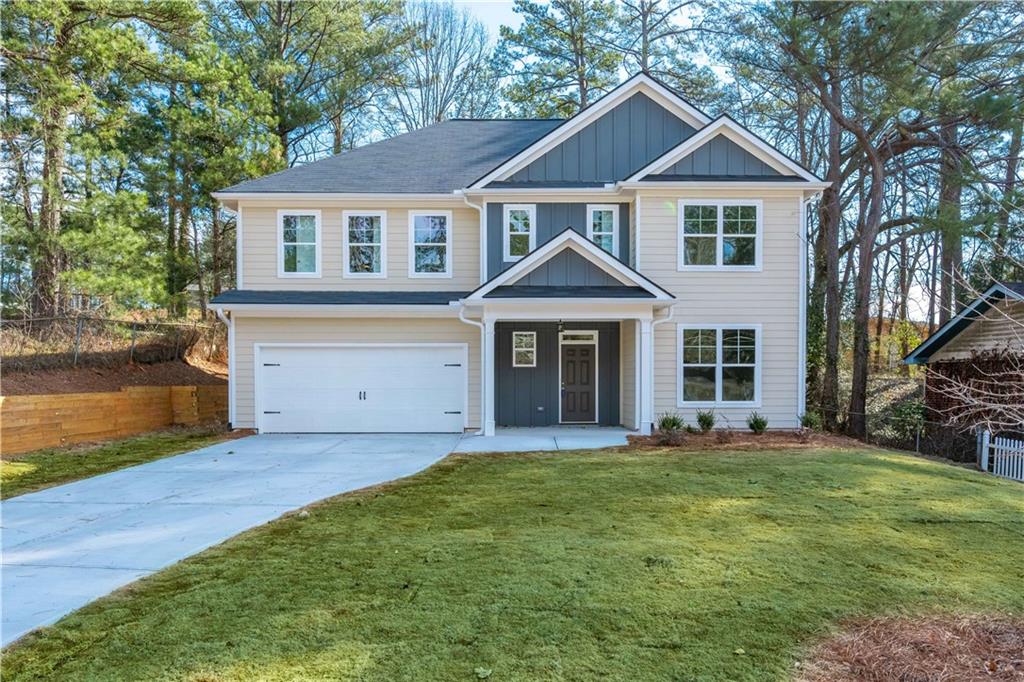 2118 Green Forrest Drive Decatur, GA 30032 - Photo 1 of 1 a front view of a house with a yard and garage