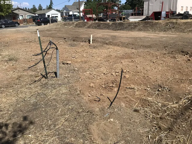 a view of a street with cars